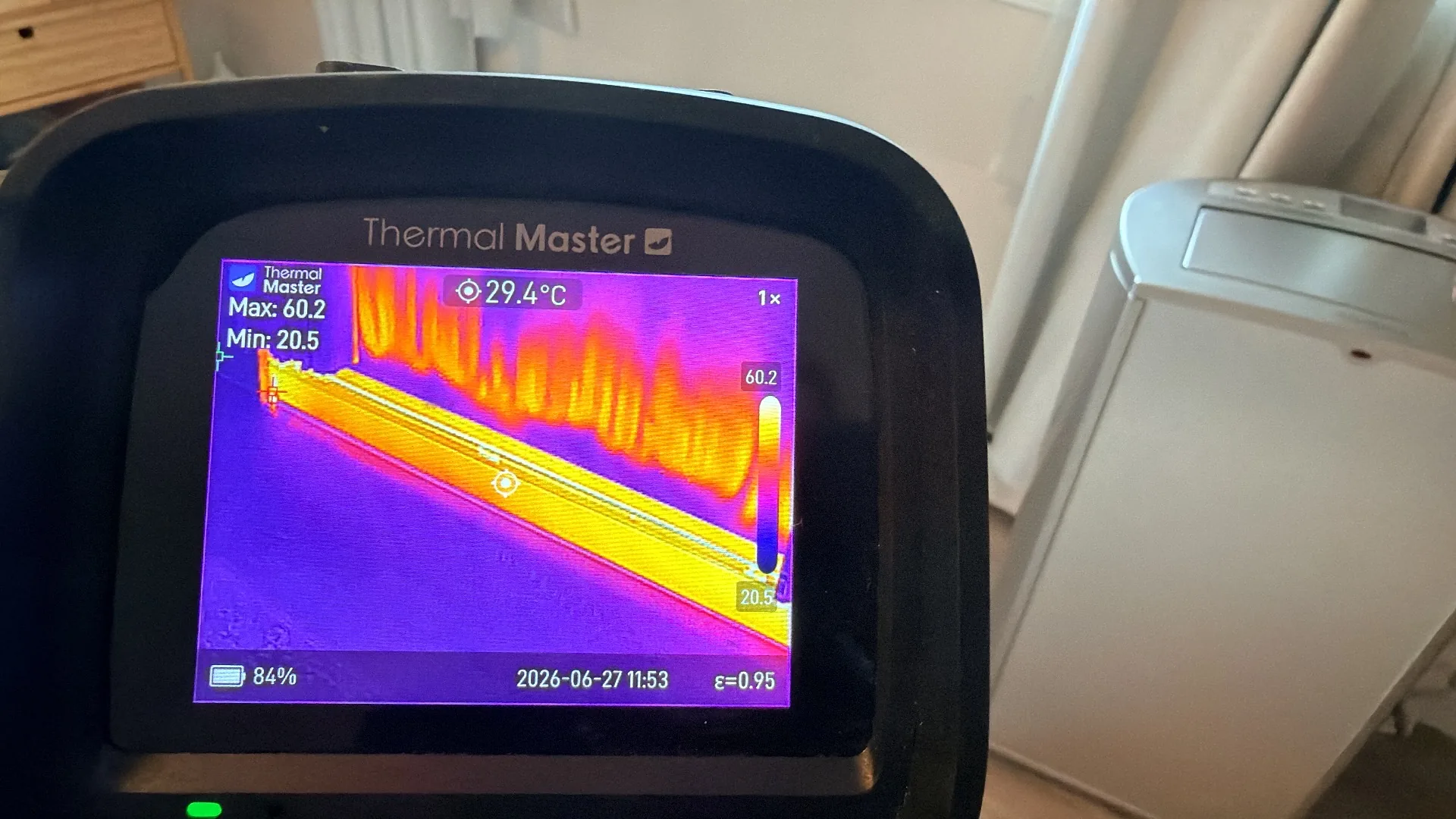 Thermal imaging of baseboard heating system showing temperature distribution